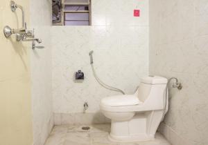a bathroom with a toilet and a shower at Jaipur 1727 Homestay in Jaipur +33 photos