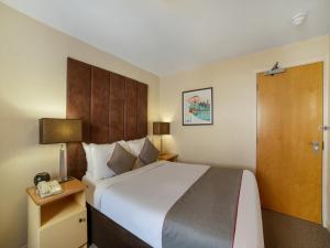 Cama o camas de una habitación en OYO Flagship Brentwood