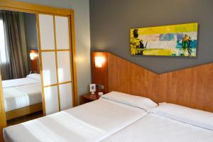 Cama o camas de una habitación en Hotel Alda Palacio Valdés
