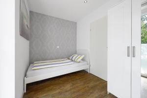 Postel nebo postele na pokoji v ubytování Apartment End