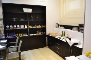 A kitchen or kitchenette at Hotel Alda Palacio Valdés