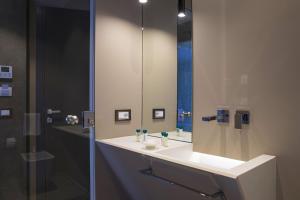 a bathroom with a sink and a mirror at Milestone in Quartu SantʼElena