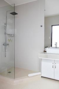 a bathroom with a shower and a sink at Blue Marina Boracay in Boracay