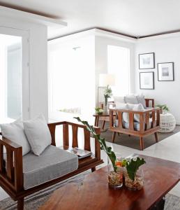 a living room with a couch and a table at Blue Marina Boracay in Boracay