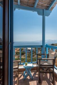 a balcony with a view of the ocean at Asterias House in Donoussa