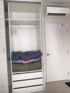 a closet with a sleeping bag in it at Dz Studio and Suite Parisien Tower i-City in Shah Alam +40 photos