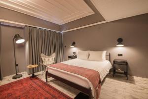 A bed or beds in a room at GARP HOTEL