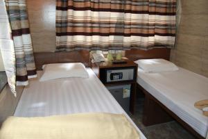 Ένα ή περισσότερα κρεβάτια σε δωμάτιο στο Russian Hostel