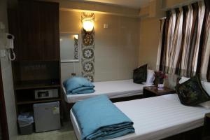 Ένα ή περισσότερα κρεβάτια σε δωμάτιο στο Russian Hostel