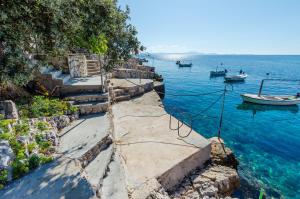 a group of boats in a body of water at Apartmani Juraj in Zavalatica