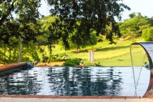 a swimming pool with a view of a park at Finca Pamel in Los Santos