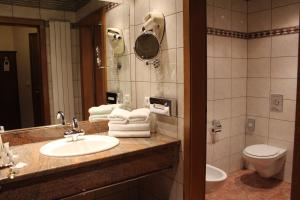 Koupelna v ubytování Hotel Le Mandelberg