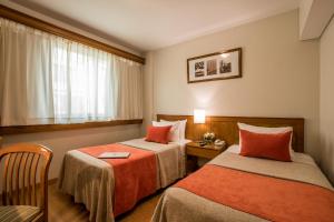 Cama ou camas em um quarto em Hotel Solans Carlton