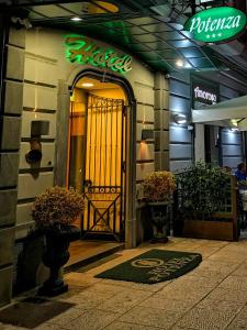 an entrance to a building with a gate in front at Hotel Potenza in Naples