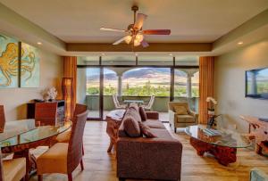 a living room filled with furniture and a large window at Lahaina Shores Beach Resort, a Destination by Hyatt Residence in Lahaina