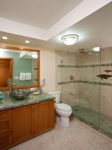 a bathroom with a toilet, sink, and bathtub at Lahaina Shores Beach Resort, a Destination by Hyatt Residence in Lahaina