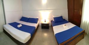 מיטה או מיטות בחדר ב-Yellow House Hostel