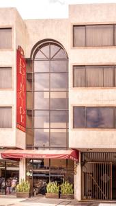 a store front of a building with a restaurant at Hotel Principe in Tuluá