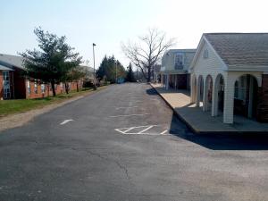 an empty street in a small town with houses at Walton Inn in Willard +8 photos