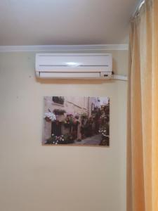 a air conditioner on a wall in a room at Thomas Palace Apartments in Sandanski