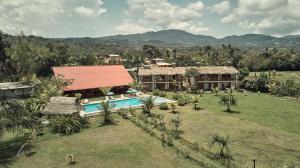 an aerial view of a house with a swimming pool at Maloca Inn in Sauce