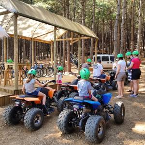 a group of people in helmets sitting on atvs at Tedesco Eco Park in São Francisco de Paula