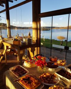 a table with many different types of food on it at Tedesco Eco Park in São Francisco de Paula
