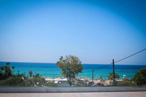 a view of the ocean from a balcony at Katrin Luxury Studios in Nea Moudania