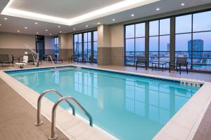 a swimming pool with a view of a building at Hyatt House Chicago West Loop in Chicago