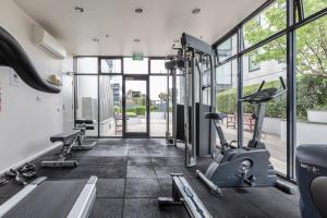 a gym with two treadmills and two ellipticals at ☆of Southbank☆Light filled apartment☆HUGE private terrace with city views☆Parking☆Pool☆Gym☆WiFi in Melbourne