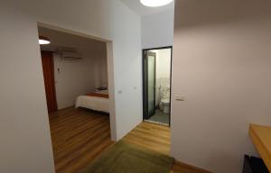Postel nebo postele na pokoji v ubytování 高寮貳陸之貳民宿 Gaoliao 26-2 Simple Home Life