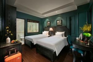 Voodi või voodid majutusasutuse Grande Collection Hotel & Spa toas