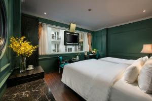Voodi või voodid majutusasutuse Grande Collection Hotel & Spa toas