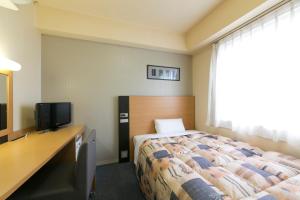 Hotel Econo Taki 객실 침대
