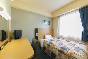 Hotel Econo Taki 객실 침대