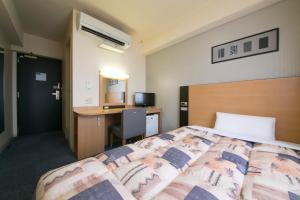 Hotel Econo Taki 객실 침대