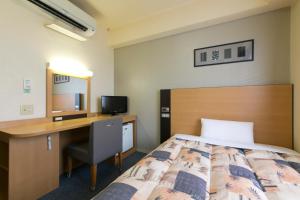 Hotel Econo Taki 객실 침대