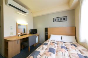 Hotel Econo Taki 객실 침대