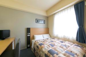 Hotel Econo Taki 객실 침대