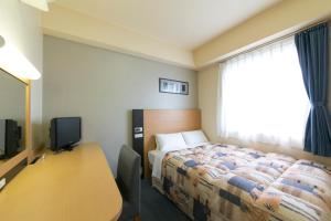 Hotel Econo Taki 객실 침대