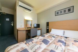 Hotel Econo Taki 객실 침대