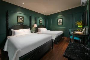 Voodi või voodid majutusasutuse Grande Collection Hotel & Spa toas