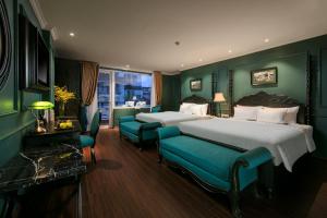 Voodi või voodid majutusasutuse Grande Collection Hotel & Spa toas