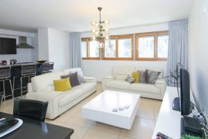 a living room with two couches and a table at 104 - King David Residence - Jerusalem-Rent in Jerusalem