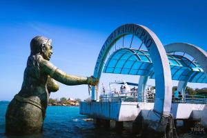 a statue in the water in front of a ride at Samed Port View in Ko Samed