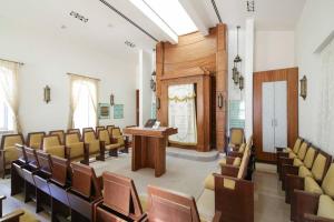 a courtroom with chairs and a podium in a building at 107 - King David Residence - Jerusalem-Rent in Jerusalem +46 photos