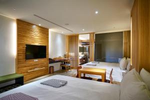Postel nebo postele na pokoji v ubytování Shine Mood Resort Yuanli