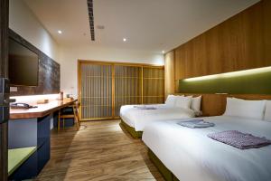 Postel nebo postele na pokoji v ubytování Shine Mood Resort Yuanli