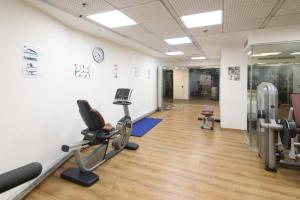 a gym with treadmills and exercise equipment in a building at 202 - King David Residence - Jerusalem-Rent in Jerusalem