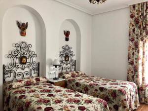 Кровать или кровати в номере EL CAPRICHO DE ANDREA,